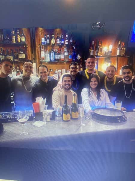 Smiling customers enjoying drinks and each other's company