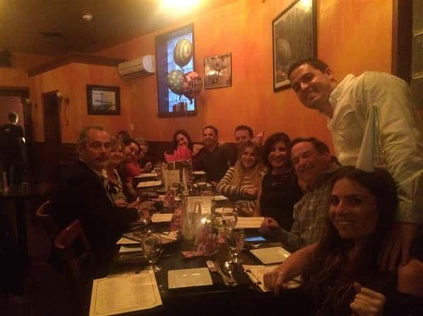 big group of people smiling and posing together