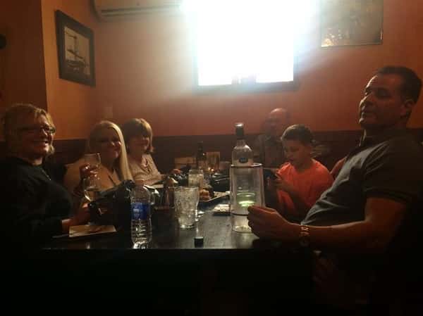 a table full of full and happy customers after their meals