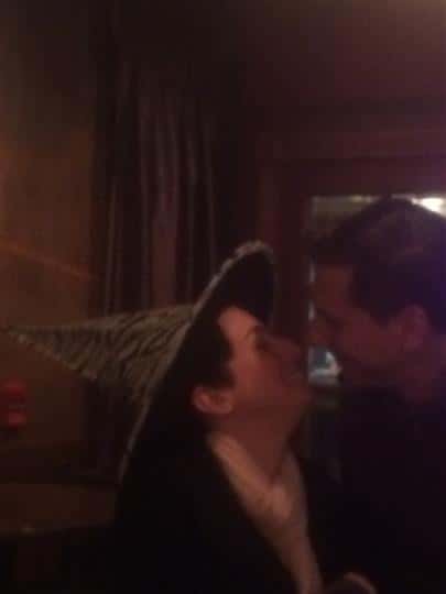 two lovebirds wearing witch hats