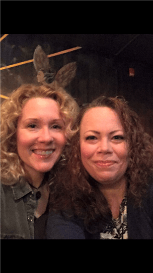 two women smiling