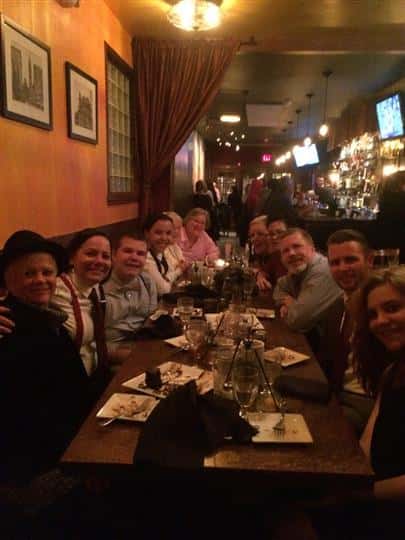 a big table of happy customers after eating their food
