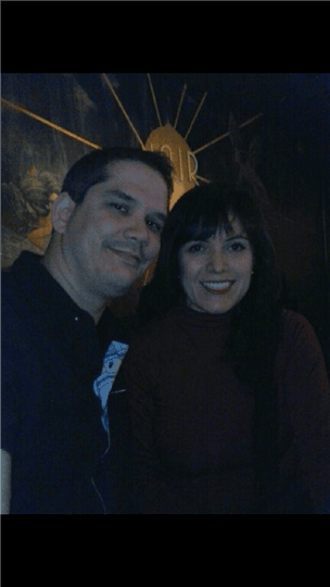 two customers smiling together