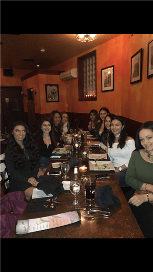 a big table of happy customers after eating their food