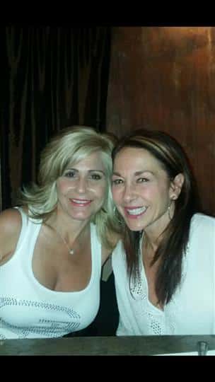 two women smiling together