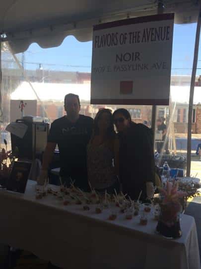 three employees at the flavors of the avenue noir table