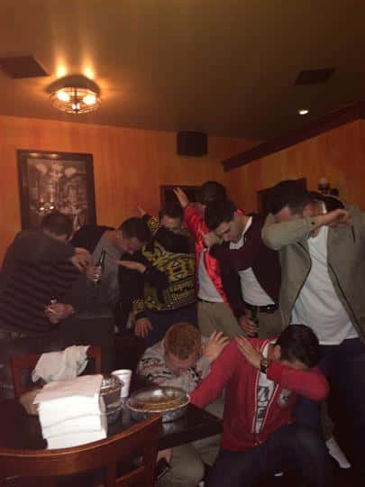 a group of guys dabbing