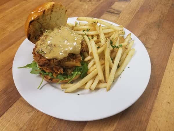 Asian Fried Chicken Sandwich With Arugula, House Kimchi, Sweet Ginger Soy Aioli, on a Toasted Brioche Bun, served with French Fries