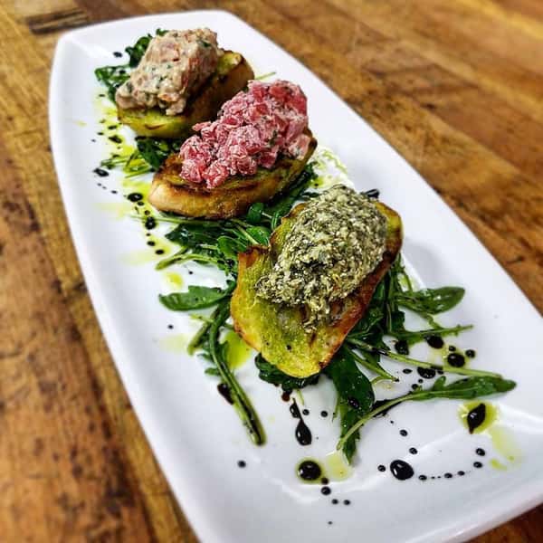 Bruschetta Trio, Beets and Cherve, Tomato Basil, and Spinach Artichoke Feta