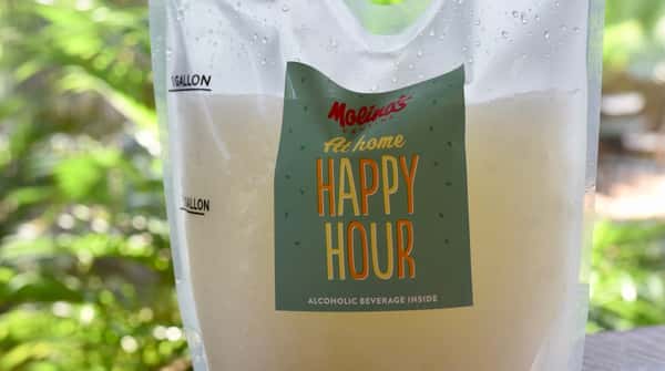 Happy Hour promotional drink displayed outdoors.