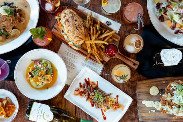 Various entrees and drinks on a table