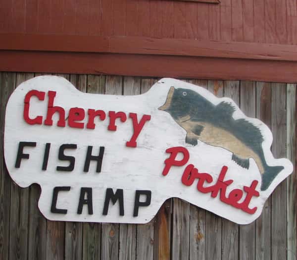 sign that reads cherry pocket fish camp