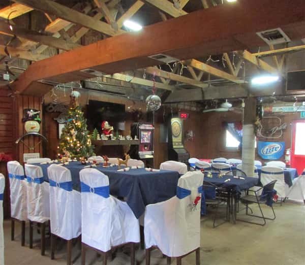tables and chairs set with utencils and table cloths