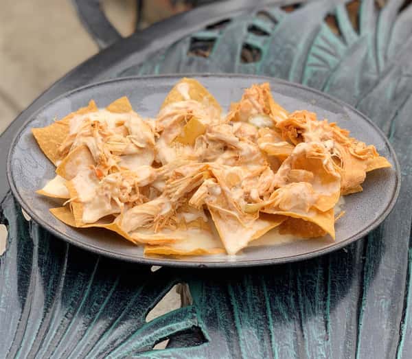 nachos with pulled chicken and melted cheese