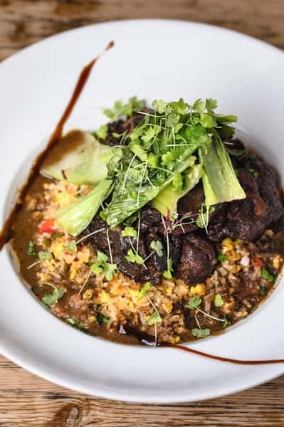 Lentil meal with meat toppings