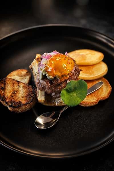 A light meal served with a topping of sauce