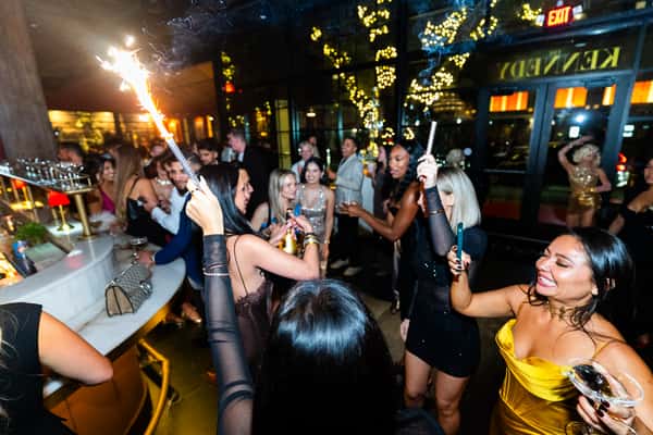 Guests enjoying an elegant evening celebration with vibrant atmosphere at The Kennedy