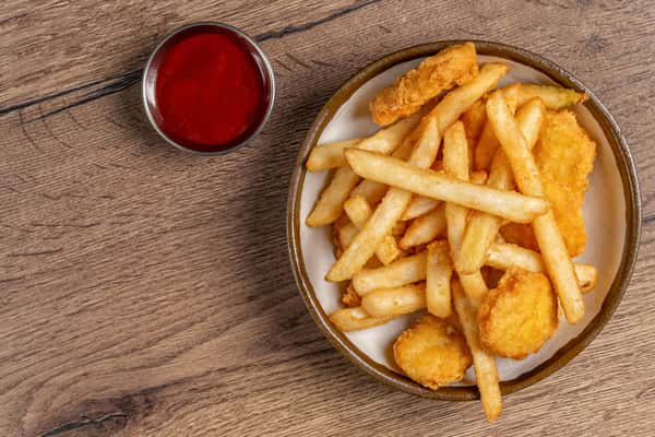 Crispy chicken nuggets and golden French fries served with a side of ketchup.