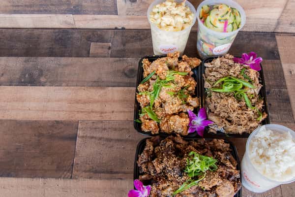 Party Package catering spread with multiple Hawaiian proteins and sides at Kalei's Kitchenette San Diego