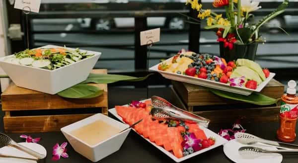 Fresh fruit platters on display at a catered event