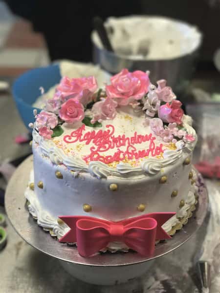 Birthday cake with rose petals