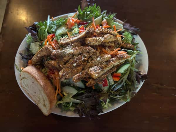 A Salad Topped with Grilled Chicken