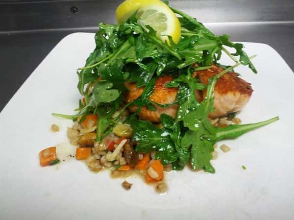 cooked fish fillet with rice and salad