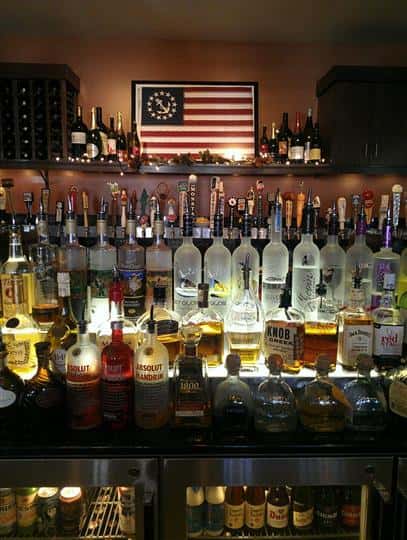 various liquor bottles displayed behind the bar area