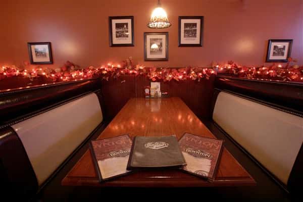 interior dining booth with decorative lighting on the walls