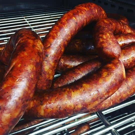 cooked sausage links on a grill