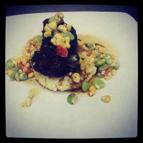 cooked beef with mashed potatoes and vegetables
