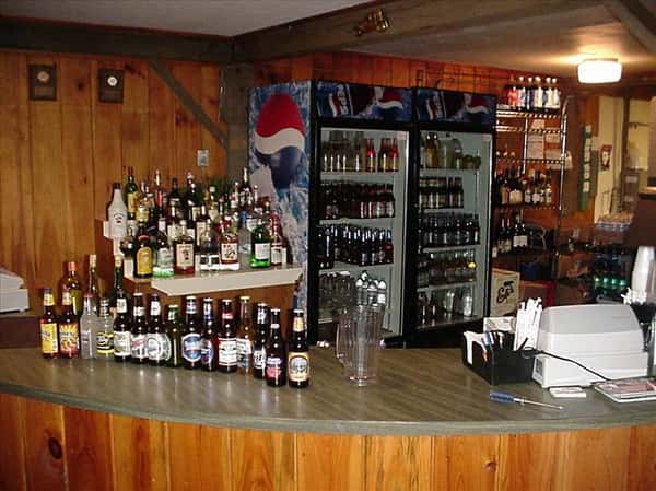 the bar, with a large assortment of alchoholic beverages