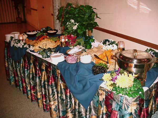 buffet table with various food dishes