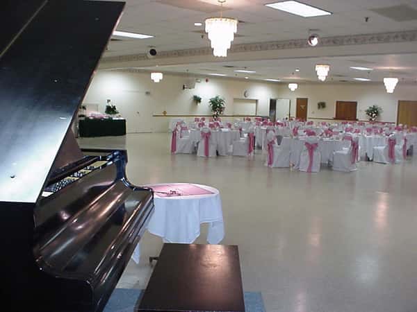 catering hall with large piano and tables