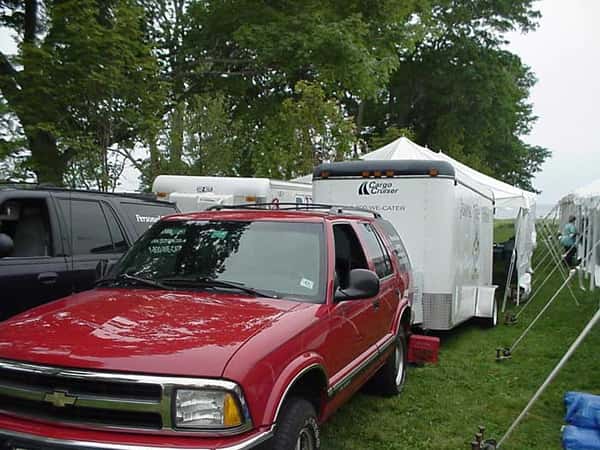 two trucks with trailers attatched