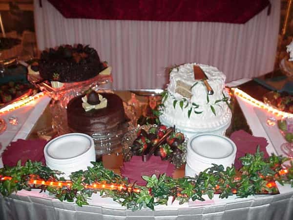 three cakes on a serving table