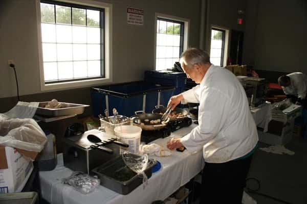 a chef cooking food in skillets