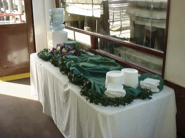 a decorated serving table with plates and napkins