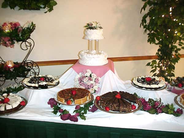 dessert table with cake and pastries