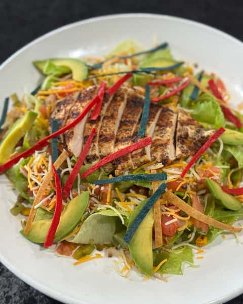 Fresh, bold, and built to satisfy 🥗 Southwest Salad brings chopped romaine, mesquite-rubbed chicken, avocado, roasted chipotle corn, pico de gallo, tortilla strips, and Southwest ranch in every bite. Stop by Rivals Brew Pub and dig in! #RivalsBrewPub #SouthwestSalad #SaladLovers