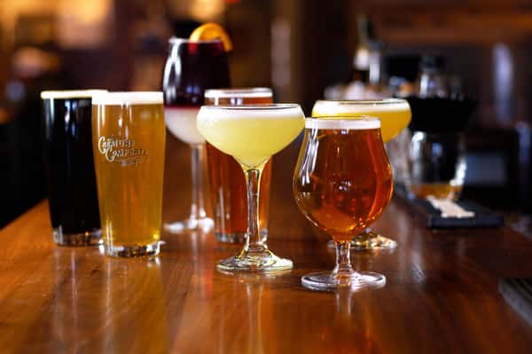 A variety of drinks and cocktails on a table