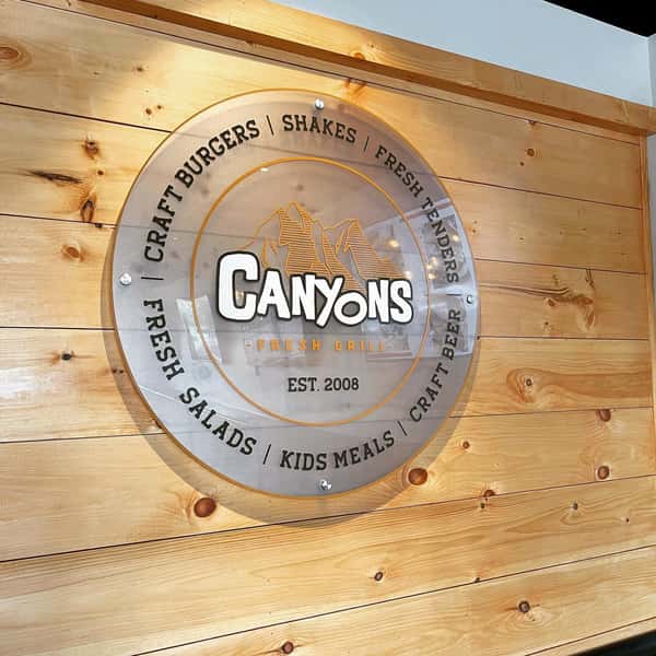 canyons sign on wooden wall