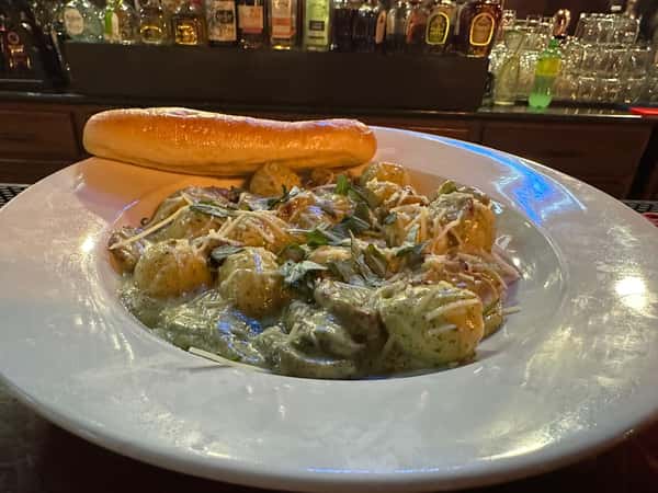 Asiago Stuffed Gnocchi with Italian Sausage in a Creamy Pesto Sauce