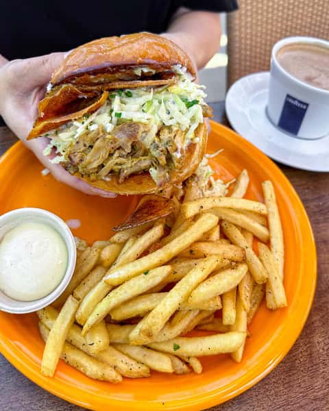 Large sandwich with fries and coffee