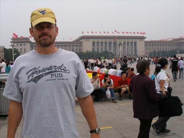 Kasey Warner inTianenman Square, China wearing Howard's Pub t-shirt.
