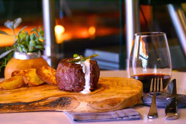 Thick-cut, juicy baseball steak served with roasted potatoes — a bold, flame-grilled favorite perfect for steakhouse lovers.
