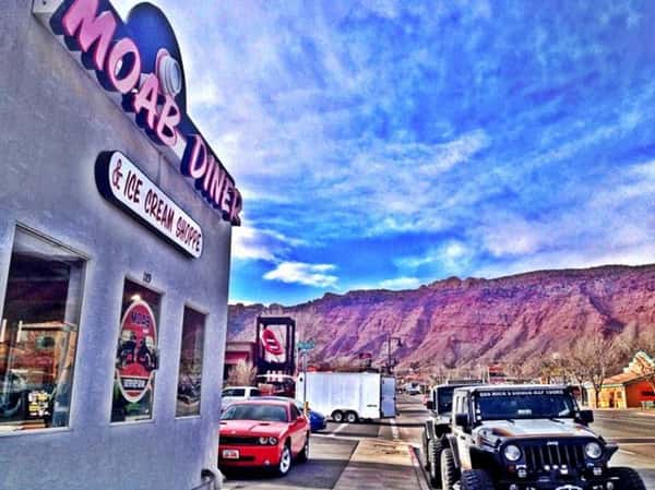 exterior building to moab diner next to a street