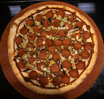 pepperoni pizza with diced green peppers, onions, and savory cheese blend