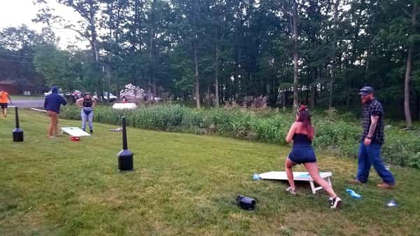 people playing cornhole outside