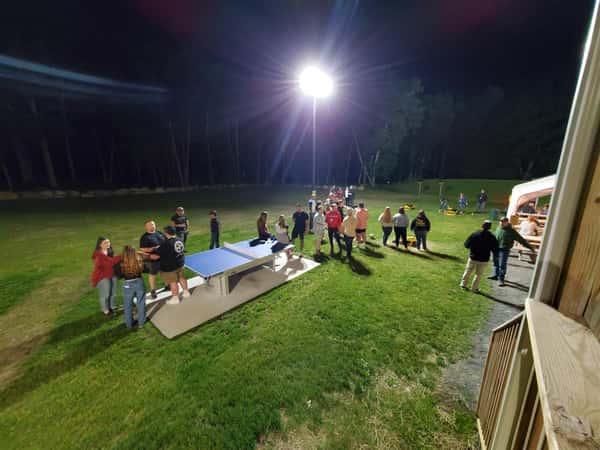 People gathering outside talking in groups